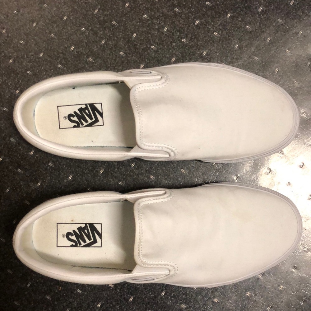 All white Vans. Men’s slip on shoe.